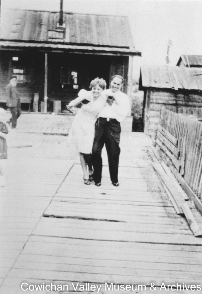 Kishen Singh pulling a friend in front of camera on the boardwalk in Paldi