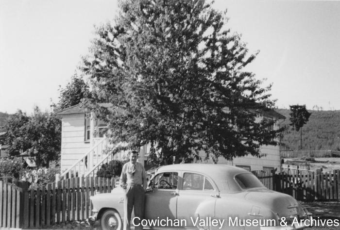 Henry McHemer company controller in front of Mayo Lmbr Co. office