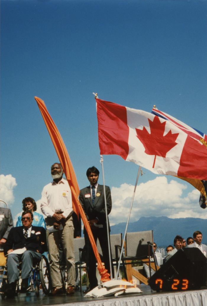 Flags on stage at the Canada Place gathering