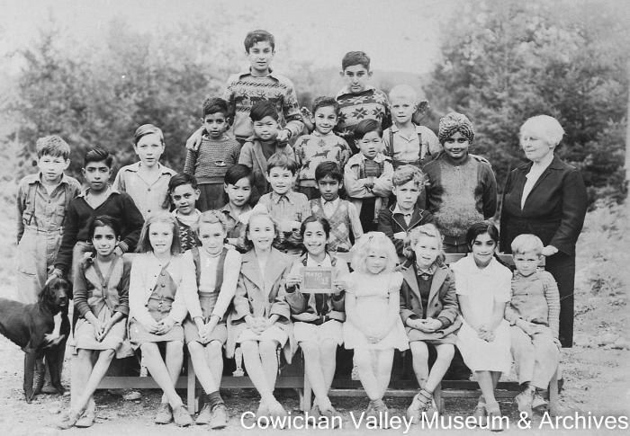 [Group of unidentified school children and teacher at Mayo School posing for class portrait]