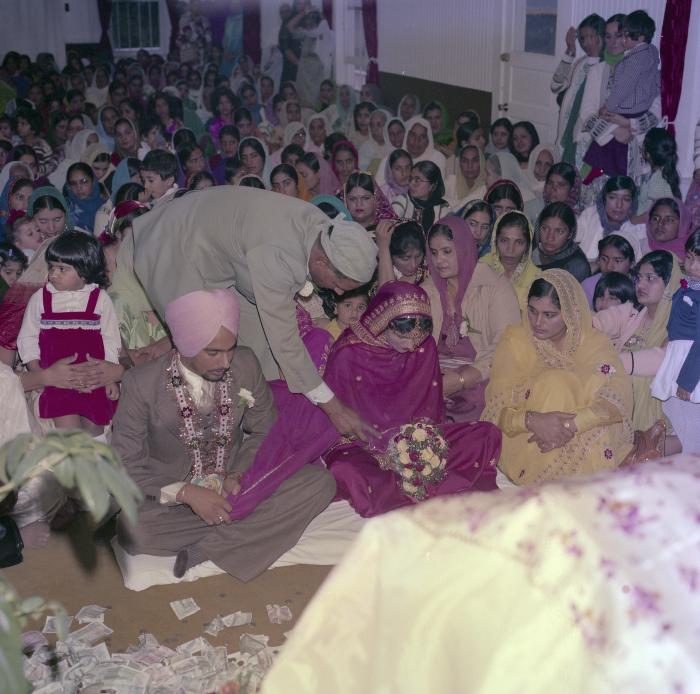 [Photo of Chindo Sidhu, Iqbal Sandhu and their wedding guests]