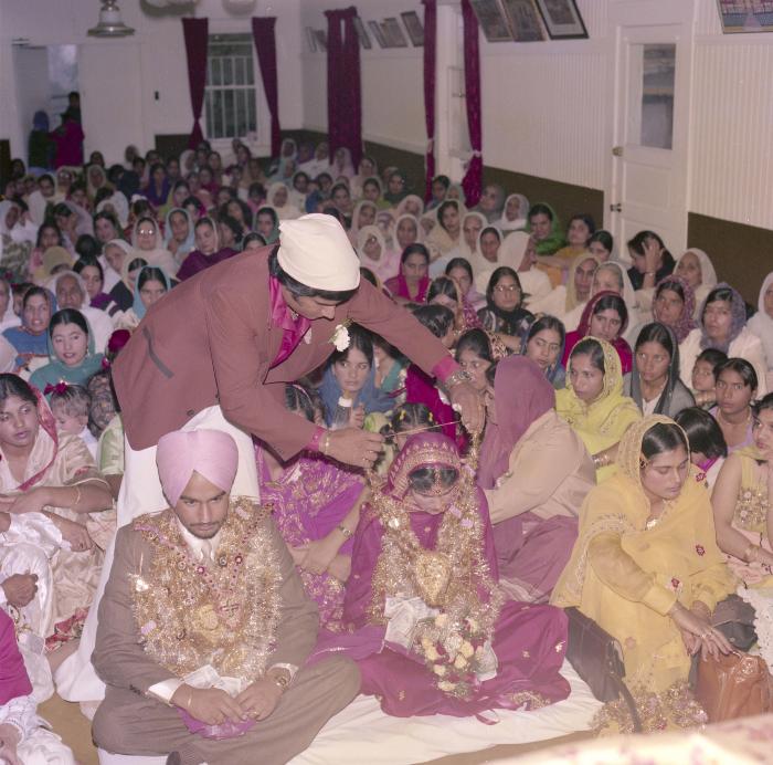 [Photo of Chindo Sidhu, Iqbal Sandhu and their wedding guests]