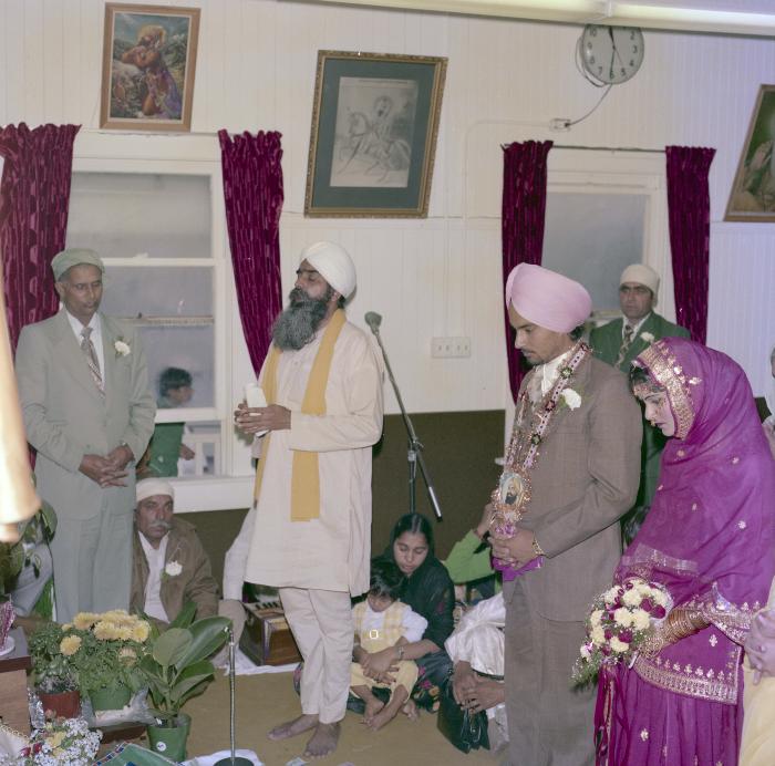 [Photo of Chindo Sidhu, Iqbal Sandhu and their wedding guests]