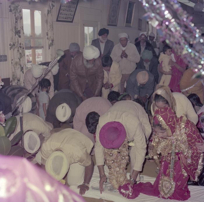 [Photo of Sinder Sandhu, Jaswant Gill and their wedding guests]