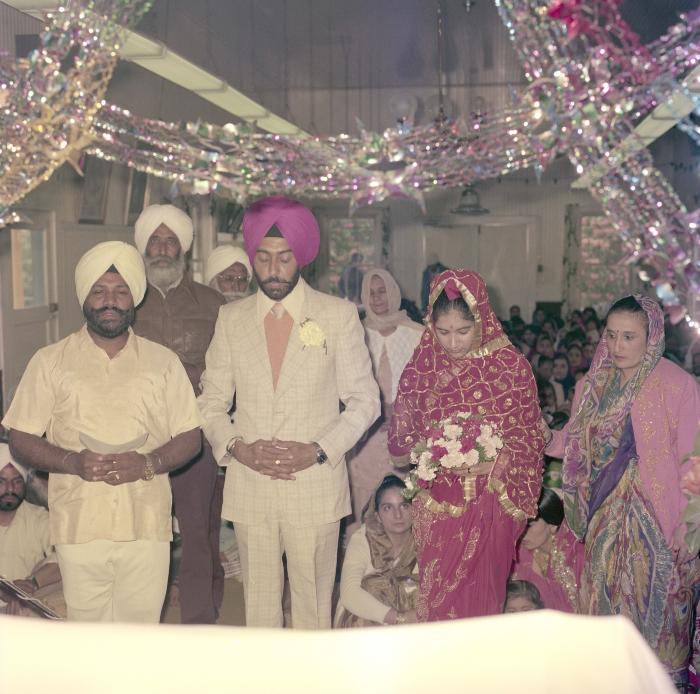 [Photo of Sinder Sandhu, Jaswant Gill and their wedding guests]