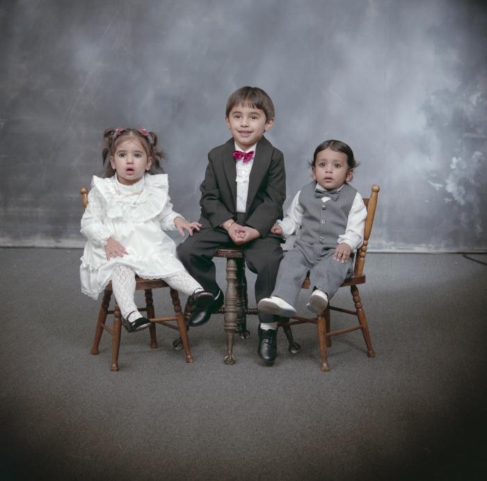[Group portrait of three unidentified children]