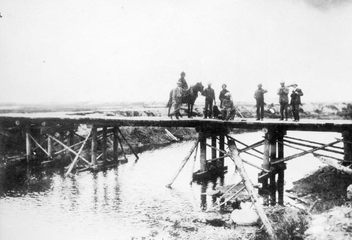 [A wooden bridge over a slough at Jericho Beach]