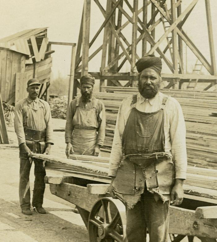 [Group photo of Sikh sawmill workers]