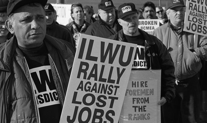 [Photo of protestors at the International Longshore and Warehouse Union rally]