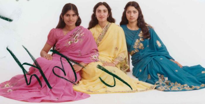 [Group portrait of Mindy Gill and two unidentified women]