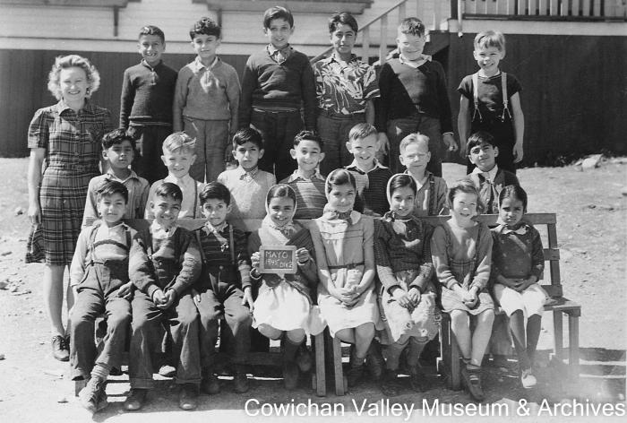 [Group of unidentified school children and teacher at Mayo School posing for class portrait]