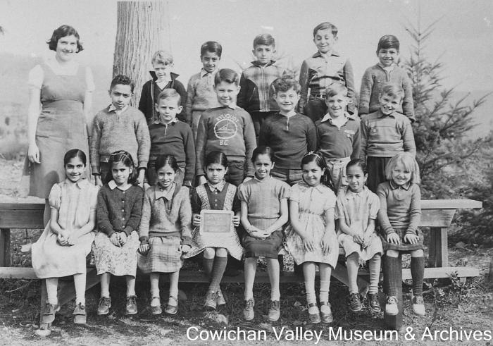 [Group of unidentified school children and teacher at Mayo School posing for class portrait]