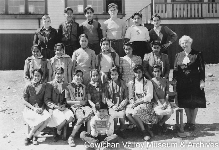 [Group of unidentified school children and teacher at Mayo School posing for class portrait]