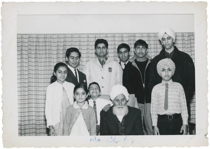 [Photo of a group of Gill family members with an Khem Singh Gill]