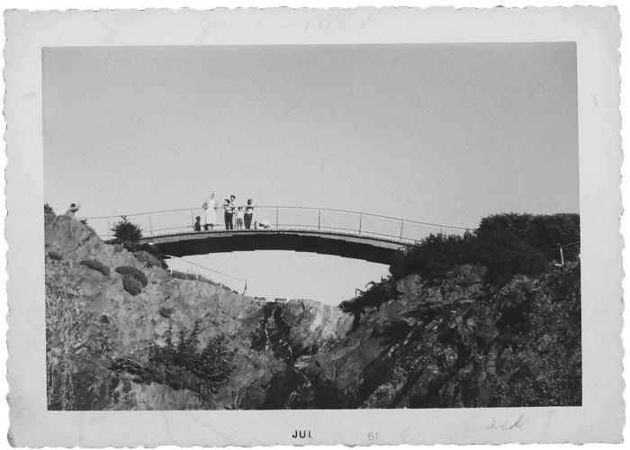 [Photo of unidentified children on a bridge]