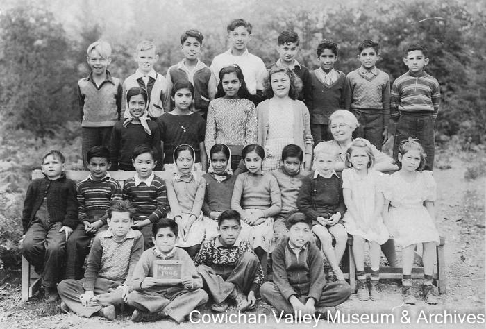 [Group of unidentified school children and teacher at Mayo School posing for class portrait]