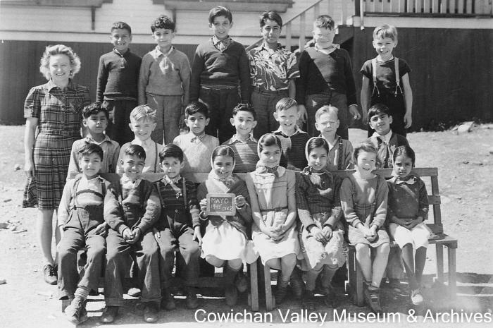 [Group of unidentified school children and teacher at Mayo School posing for class portrait]