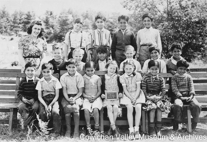 [Group of unidentified school children and teacher at Mayo School posing for class portrait]
