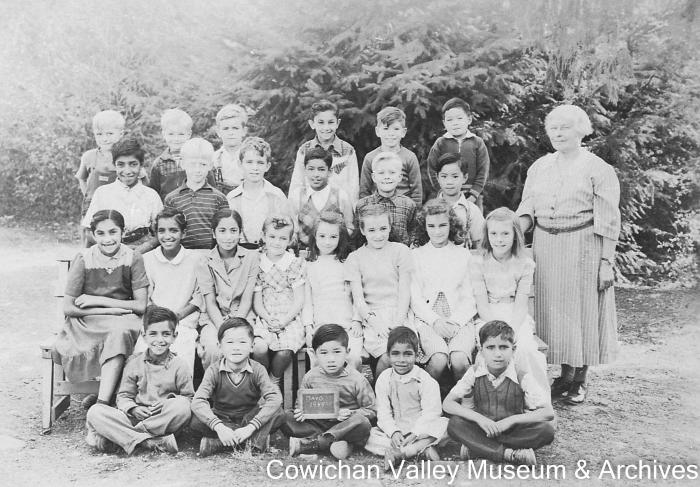 [Group of unidentified school children and teacher at Mayo School posing for class portrait]