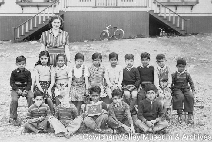 [Group of unidentified school children and teacher at Mayo School posing for class portrait]