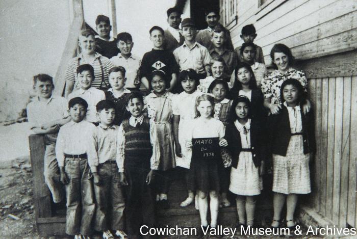 [Group of unidentified school children and teacher at Mayo School posing for class portrait]