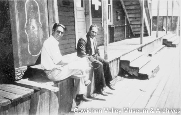 [Kishen Singh Parhar and Atma Singh Dodd sitting outside an office building]