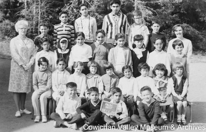 [Group of unidentified school children and teacher at Mayo School posing for class portrait]