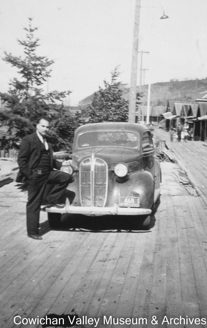 [Kishen Singh Parhar with his leg on a car on Paldi's boardwalk]