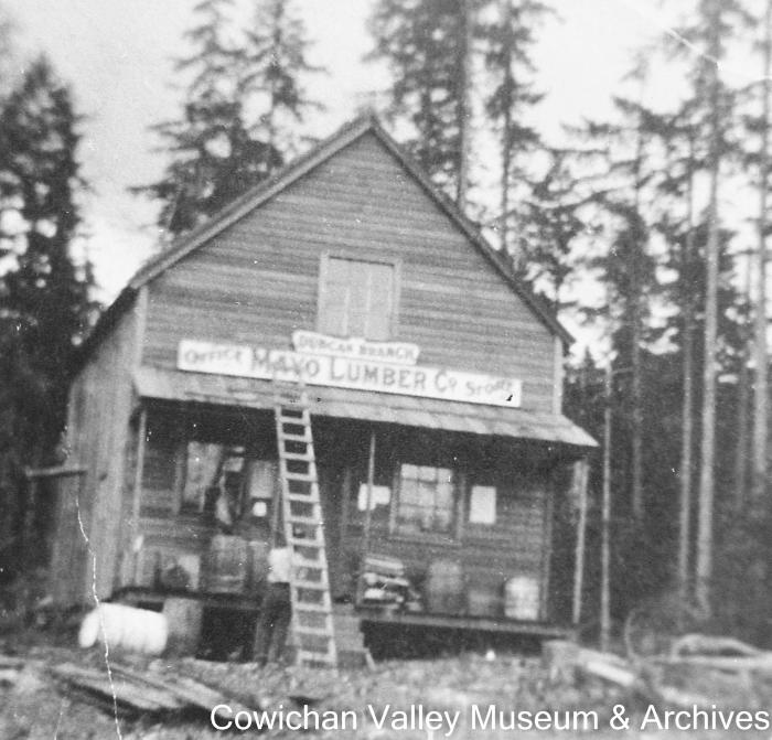 [The Duncan branch of the Mayo Lumber Co. office and store with an unidentified group of people]